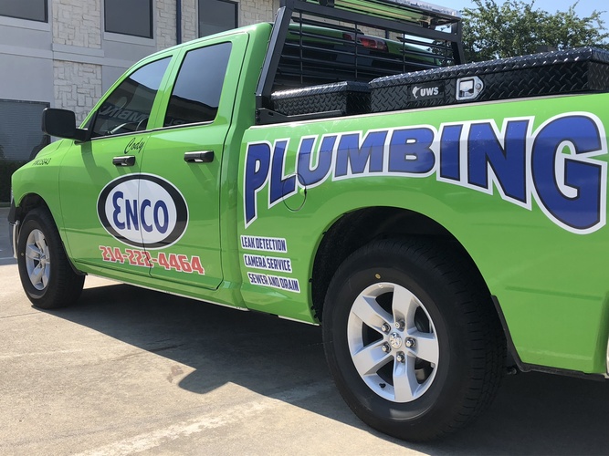 the green ENCO Plumbing work truck